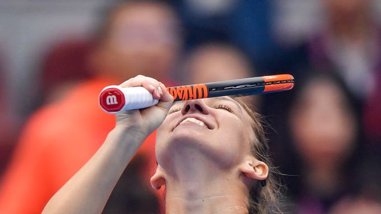 Simona Halep reacts as she becomes world number one with victory over Jelena Ostapenko