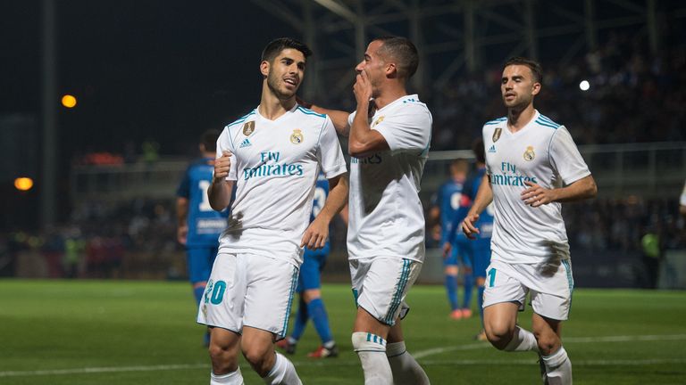 MADRID, SPAIN - OCTOBER 26: Marco Asensio (left) of Real Madrid CF celebrates with Lucas Vazquez after scoring his teamÕs opening goal from a penalty kick