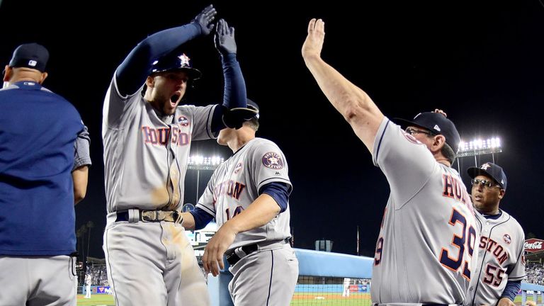  George Springer celebrates after hitting a two-run home run during the 11th inning