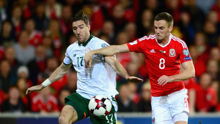 Stephen Ward of the Republic of Ireland and Andy King of Wales battle for the ball during the FIFA 2018 World Cup Qualifier