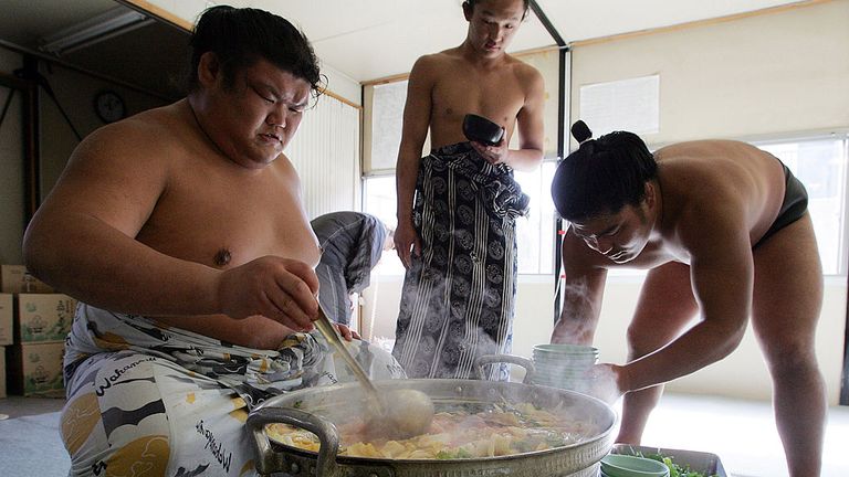 OSAKA, JAPAN - MARCH 01:  Sumo wrestlers serve up 'chanko-nabe' during a "Sumo Diet Campaign" event at Musashigawa Sumo Stable on March 1, 2007 in Osaka,.