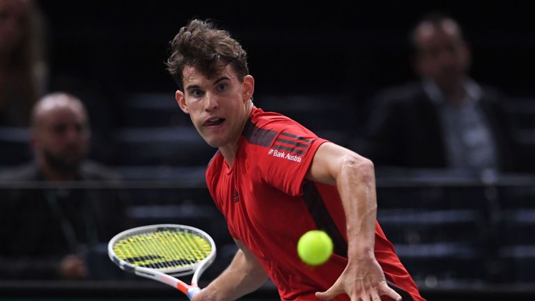 Austria's Dominic Thiem returns the ball to Germany's Peter Gojowczyk during their first round match at the ATP World Tour Masters 1000 indoor tennis