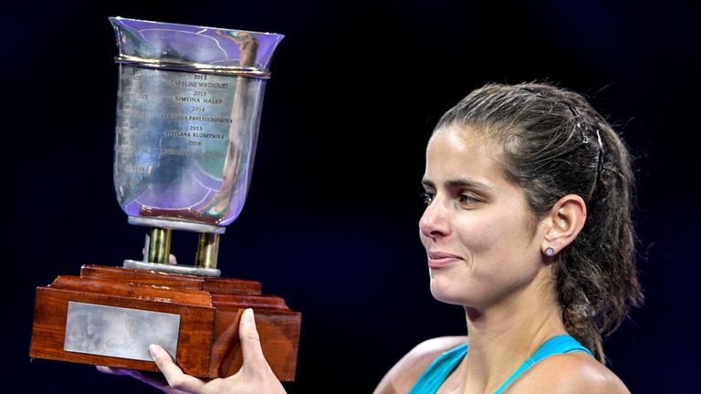 Germany's Julia Goerges poses with the trophy as she celebrates after her victory over Russia's Daria Kasatkina in the Kremlin Cup