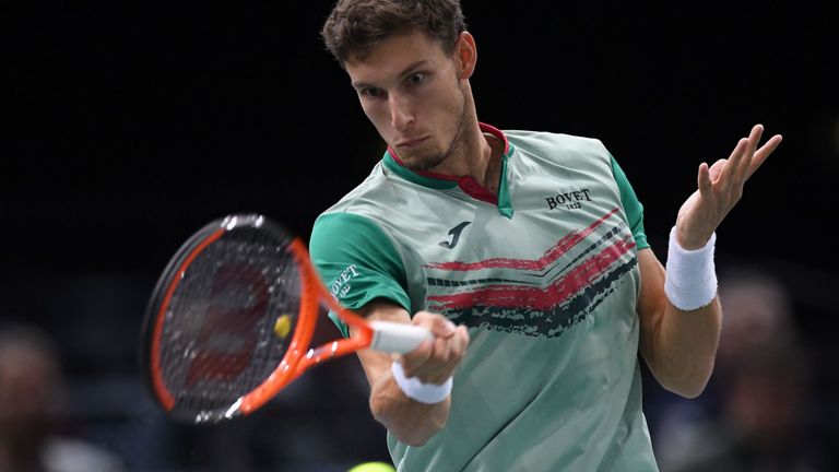 Spain's Pablo Carreno Busta returns the ball to France's Nicolas Mahut during their first round match at the ATP World Tour Masters 1000