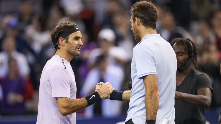 Roger Federer of Switzerland is congratulated by Juan Martin del Potro of Argentina