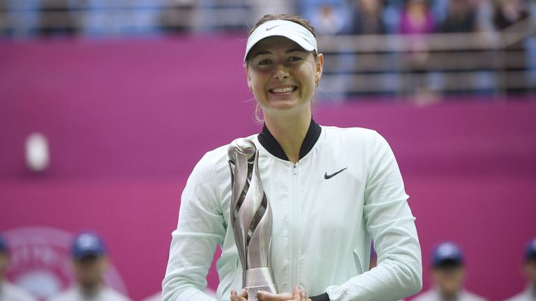 Maria Sharapova of Russia holds her trophy after winning her women's singles final match against Aryna Sabalenka of Belarus at the Tianjin Open tennis tour