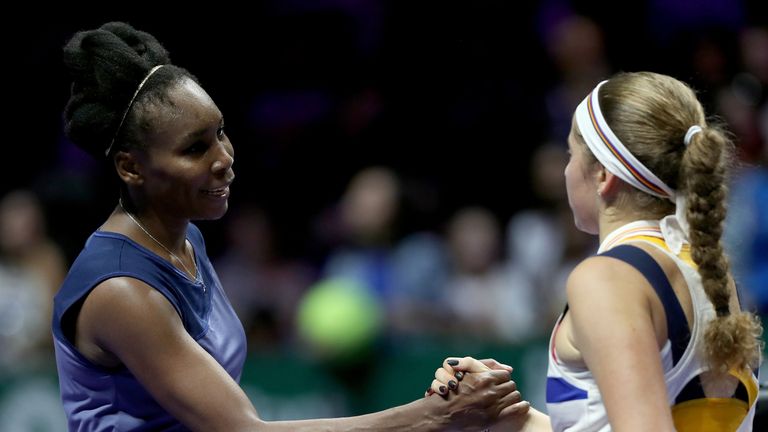 Venus Williams of the United States is congratulated by Jelena Ostapenko of Latvia after their match during WTA Finals