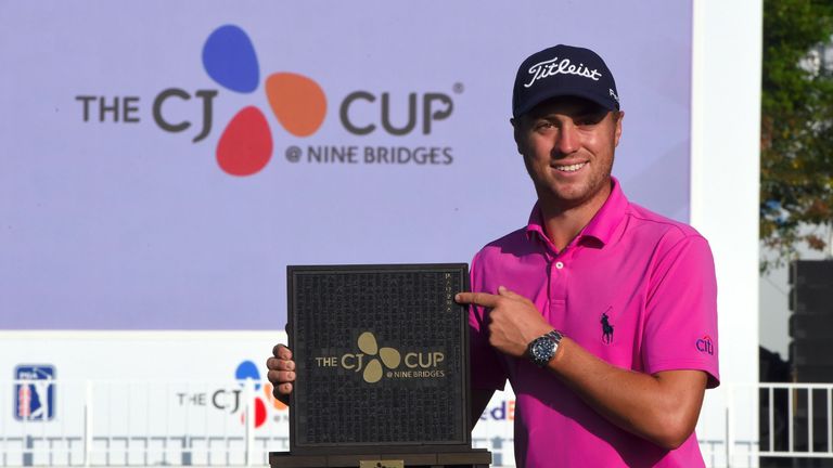Justin Thomas of the US poses with the trophy at the awards ceremony after winning the CJ Cup golf tournament at Nine Bridges in Jeju Island on October 22,