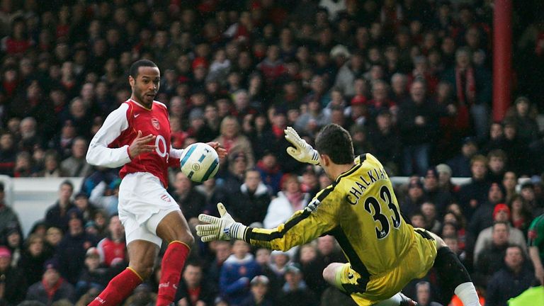 LONDON - MARCH 5:  Thierry Henry of Arsenal shoots past Kostas Chalkias of Portsmouth to score during the Barclays Premiership match between Arsenal and Po