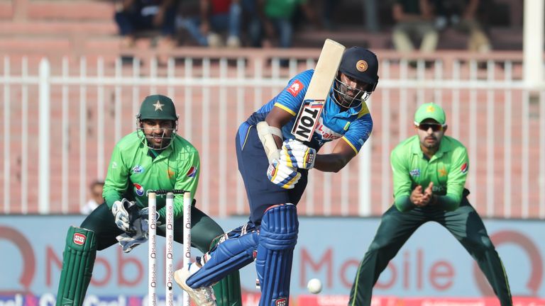 Thisara Perera (C) of Sri Lanka plays a shot during the fifth one day international (ODI) cricket match between Sri Lanka and Pakistan at Sharjah Cricket S