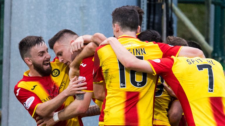 Partick Thistle's Miles Storey is mobbed by team mates after scoring a late winner against Dundee on Saturday.