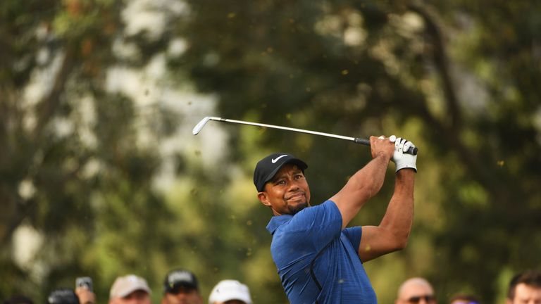 DUBAI, UNITED ARAB EMIRATES - FEBRUARY 02:  Tiger Woods of the United States tees off on the 11th hole during the first round of the Omega Dubai Desert Cla