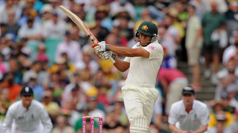 Australian batsman Usman Khawaja (C) pulls the ball for four runs on his debut on day one of the fifth Ashes cricket Test against England