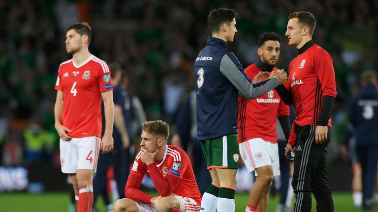 CARDIFF, UNITED KINGDOM - OCTOBER 09:  Aaron Ramsey of Wales looks dejected in defeat with team mates after the FIFA 2018 World Cup Group D  Qualifier betw