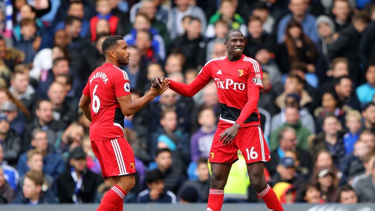 LONDON, ENGLAND - OCTOBER 21:  Abdoulaye Doucoure of Watford celebrates with Adrian Mariappa of Watford after scoring his side's first goal