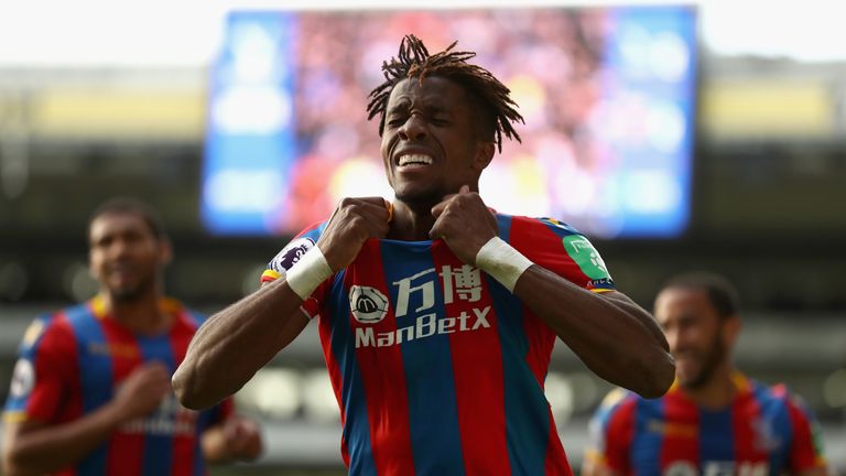 LONDON, ENGLAND - OCTOBER 28:  Wilfried Zaha of Crystal Palace celebrates scoring his sides second goal during the Premier League match between Crystal Pal