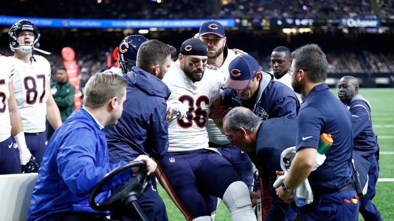 NEW ORLEANS, LA - OCTOBER 29:   Zach Miller #86 of the Chicago Bears is helped off the field after sustaining an injury during the third quarter against th