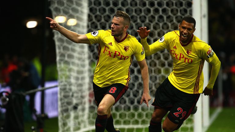 Tom Cleverley (l) and Etienne Capoue celebrate the goal which beat Arsenal at Vicarage Road two weeks' ago