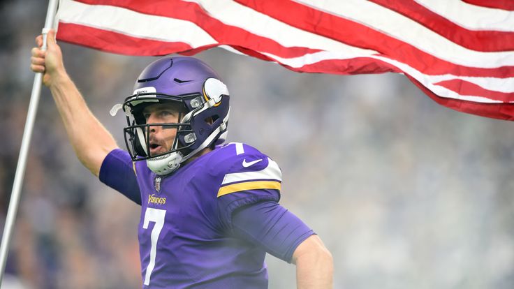 MINNEAPOLIS, MN - NOVEMBER 19: Case Keenum #7 of the Minnesota Vikings carries out an American flag during player introductions before the game against the