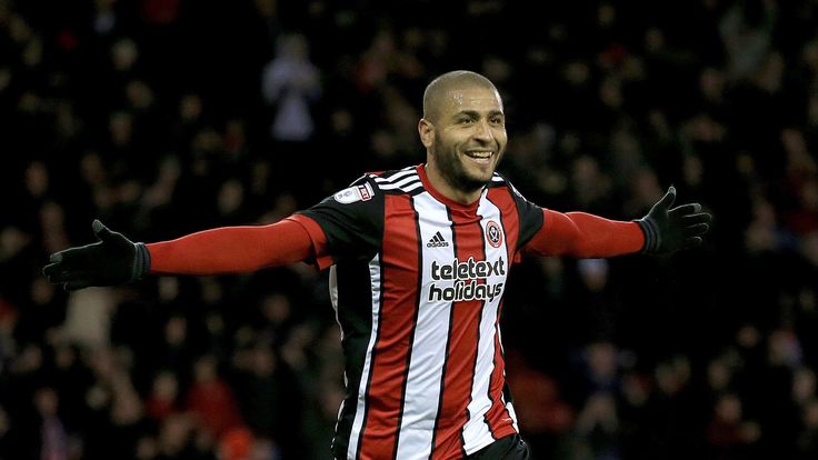 Leon Clarke celebrates after completing his hat-trick