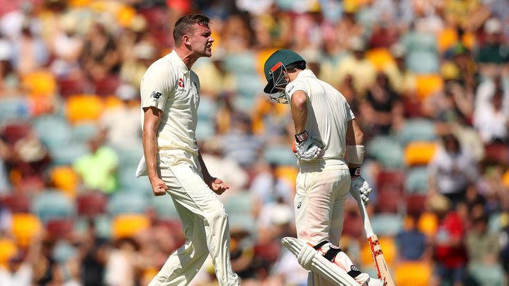 Jake Ball of England celebrates dismissing David Warner of Australia during day two of the First Test Match