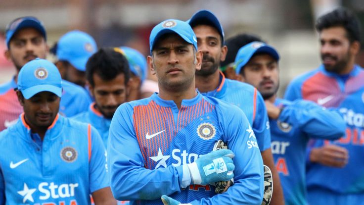 India's Mahendra Singh Dhoni leads his team after victory during the third and final T20