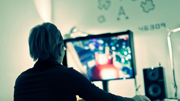 Woman playing computer games.