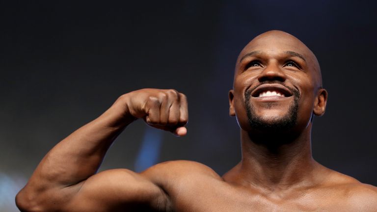 LAS VEGAS, NV - AUGUST 25:  Boxer Floyd Mayweather Jr. poses on the scale during his official weigh-in at T-Mobile Arena on August 25, 2017 in Las Vegas, N