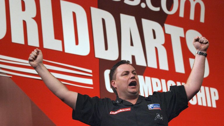 Canada's John Part celebrates winning his semi-finals match against England's Kevin Painter in the World Darts Championships at Alexandra Palace, in London