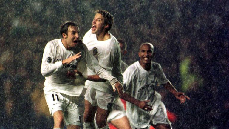 Lee Bowyer celebrates after his shot is fumbled in by Dida to give Leeds victory over AC Milan