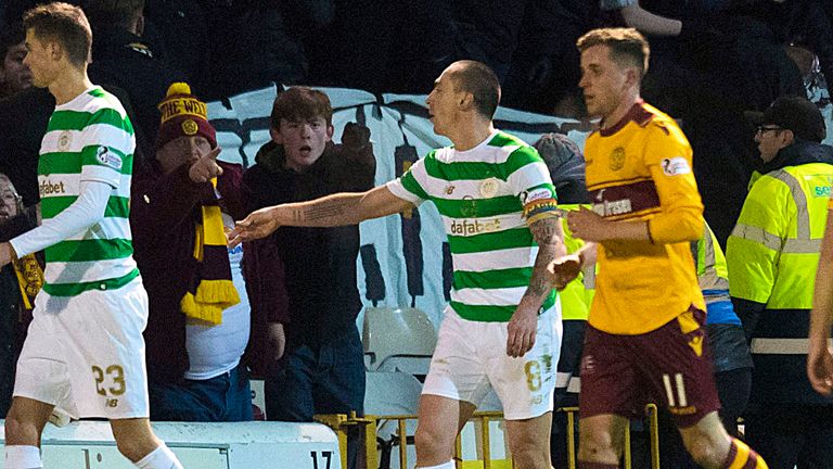 Celtic captain Scott Brown, shown throwing a coin off the pitch, claims they were thrown at away players in Wednesday's 1-1 draw at Fir Park