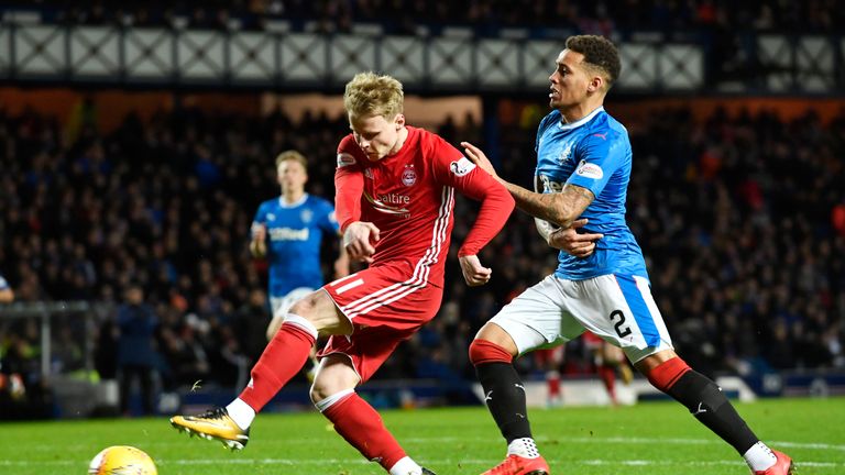 Gary Mackay-Steven (left) felt he should have had a penalty from this clash with Tavernier but nothing was given