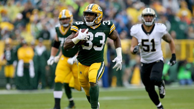 GREEN BAY, WI - OCTOBER 22:  Aaron Jones #33 of the Green Bay Packers runs with the ball in the first quarter against the New Orleans Saints at Lambeau Fie