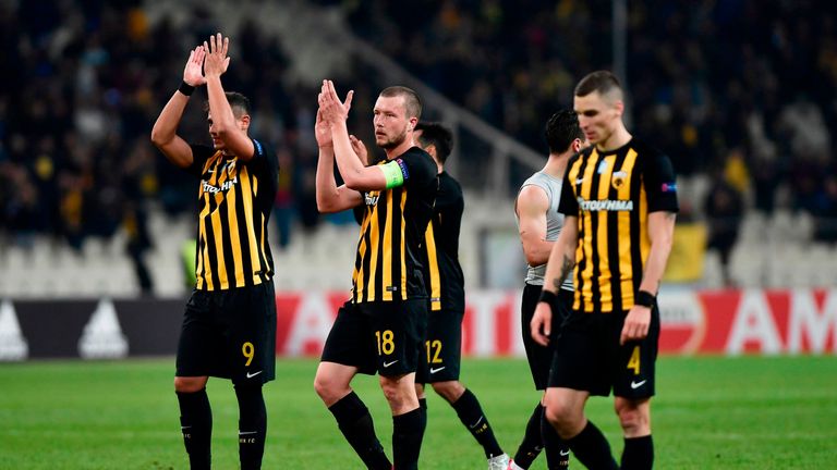 AEK's players applaud as they acknowledge their fans after the UEFA Europa League Group D football match between AEK Athens and AC Milan