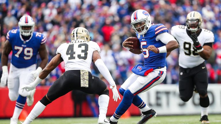 Tyrod Taylor #5 of the Buffalo Bills runs with the ball as Marcus Williams #43 of the New Orleans Saints attempts to tackle