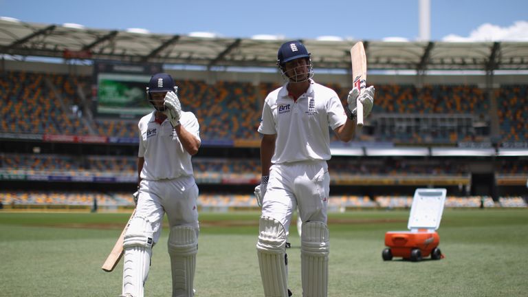 Jonathan Trott of England leaves the field after making a century and Alastair Cook of England after reaching his double ton