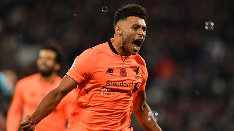 Alex Oxlade-Chamberlain celebrates after scoring Liverpool's third