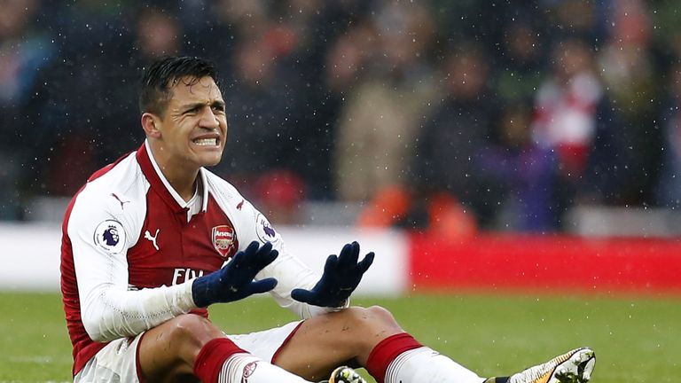 Alexis Sanchez gestures after being fouled during the north London derby