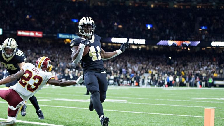 NEW ORLEANS, LA - NOVEMBER 19:  Alvin Kamara #41 of the New Orleans Saints jumps runs the ball in for a touchdown during a game against the Washington Reds
