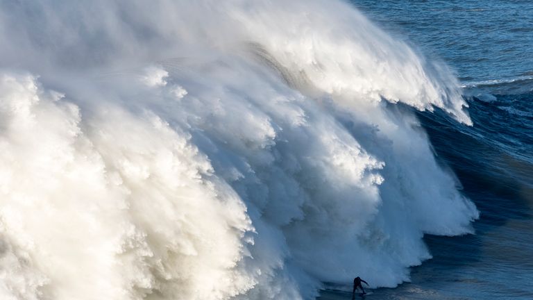 Britan big wave surfer Andrew Cotton drops a wave on way to wiping out during a surf session in Nazare, Portugal