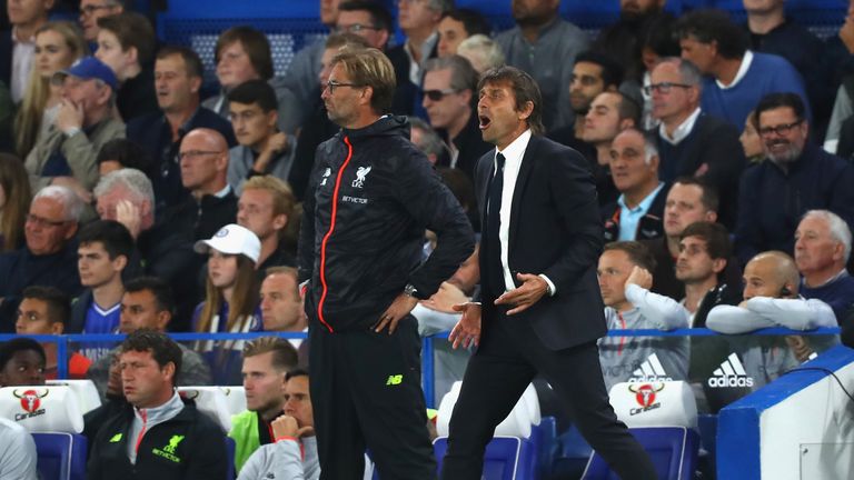LONDON, ENGLAND - SEPTEMBER 16: Antonio Conte, Manager of Chelsea and Jurgen Klopp, Manager of Liverpool look on from the touchline during the Premier Leag