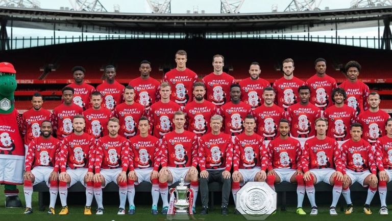 Arsenal pose in their Christmas jumpers (Twitter: @Arsenal)