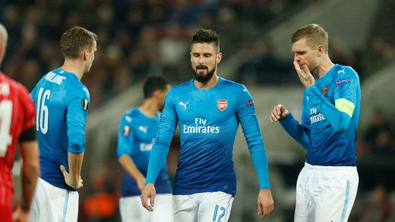 Arsenal's Rob Holding, Olivier Giroud and Per Mertesacker react after going behind against Cologne