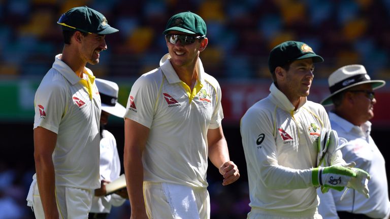 Australian players Mitchell Starc (L), Josh Hazlewood (C) and wicketkeeper Tim Paine walk back to the pavilion at the end of England's second innings on th