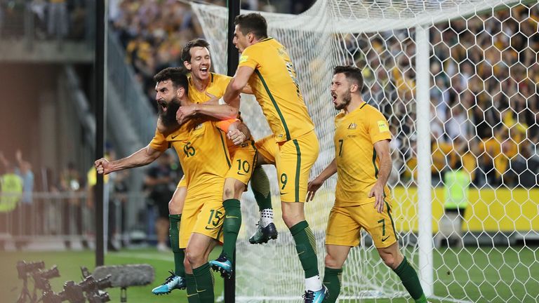 Mile Jedinak celebrates with team-mates after scoring against Honduras during the 2018 World Cup Qualifier, Second Leg in Sydney