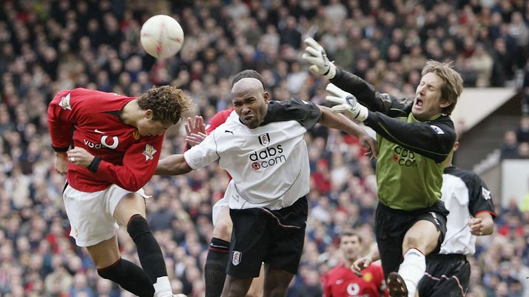 MANCHESTER, ENGLAND - MARCH 6:  Cristiano Ronaldo of Man Utd clashes with Barry Hayles and Edwin Van Der Sar of Fulham during the FA Cup Quarter Final matc