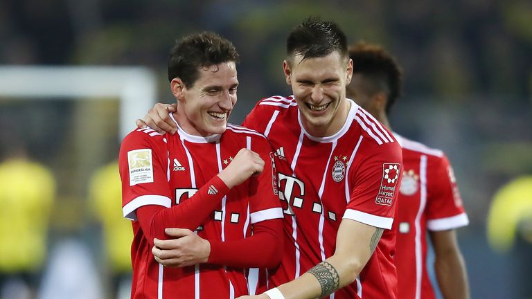 DORTMUND, GERMANY - NOVEMBER 04: Sebastian Rudy of Bayern Muenchen (l) and Niklas Suele of Bayern 