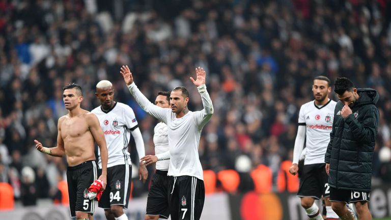 Besiktas' players celebrate with their fans after maintaining their unbeaten start to the Champions League