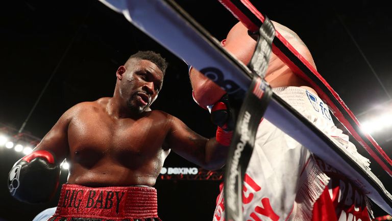 Jarrell Miller punches Mariusz Wach during their Heavyweight  bout at Nassau Veterans Memorial Coliseum on November 11, 2017 