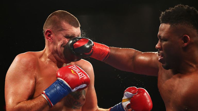 Jarrell Miller punches Mariusz Wach during their Heavyweight  bout at Nassau Veterans Memorial Coliseum on November 11, 2017 